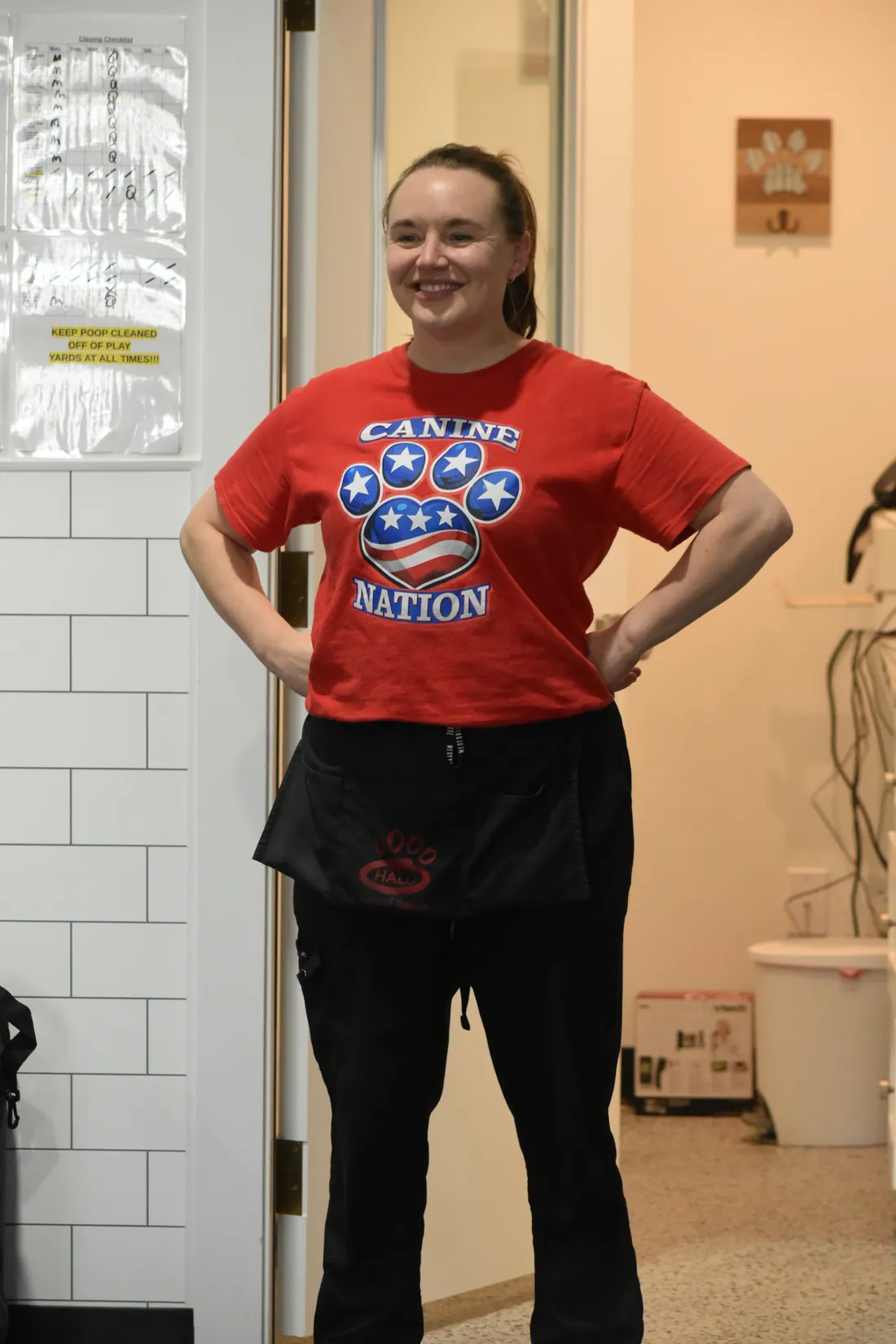 A Canine Nation groomer in the grooming room